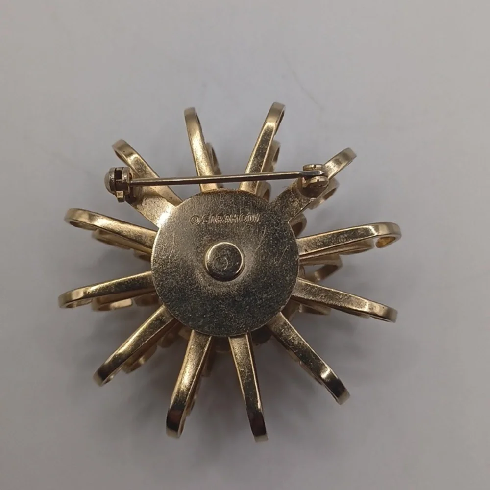 Sarah Coventry Gold-Tone Starburst Brooch with Blue Opalescent Rivoli Center - Picture 5 of 6